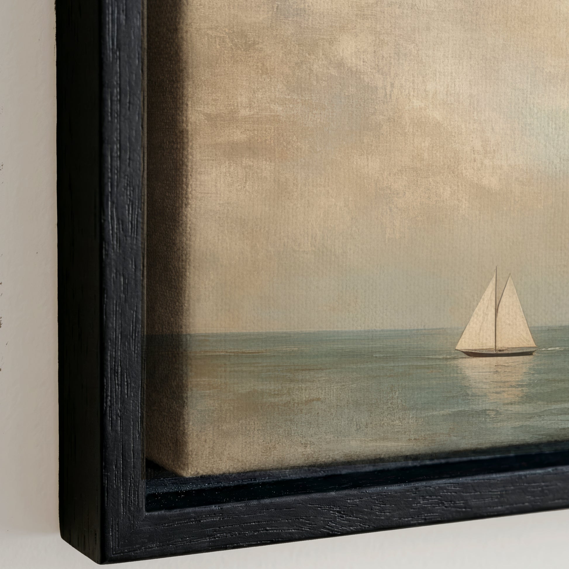 a sailboat on the water, with a cloudy sky in the background.