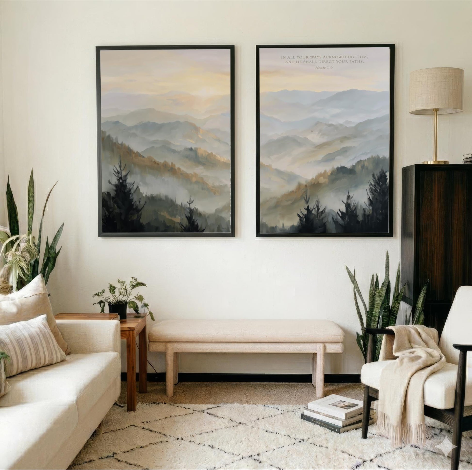 a cozy living room with two large framed landscape paintings hanging on the wall, depicting a serene mountain scene. The room is furnished with a white sofa, a wooden side table, and a beige armchair, creating a warm and inviting atmosphere. The room is also adorned with several potted plants, adding a touch of greenery and natural beauty to the space.