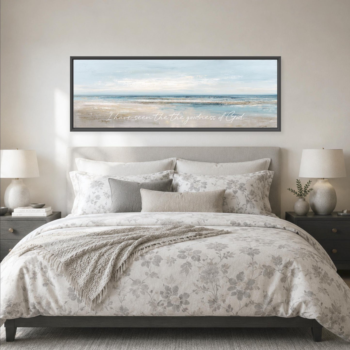 a large bedroom with a bed, nightstands, and a framed landscape painting hanging above the bed.