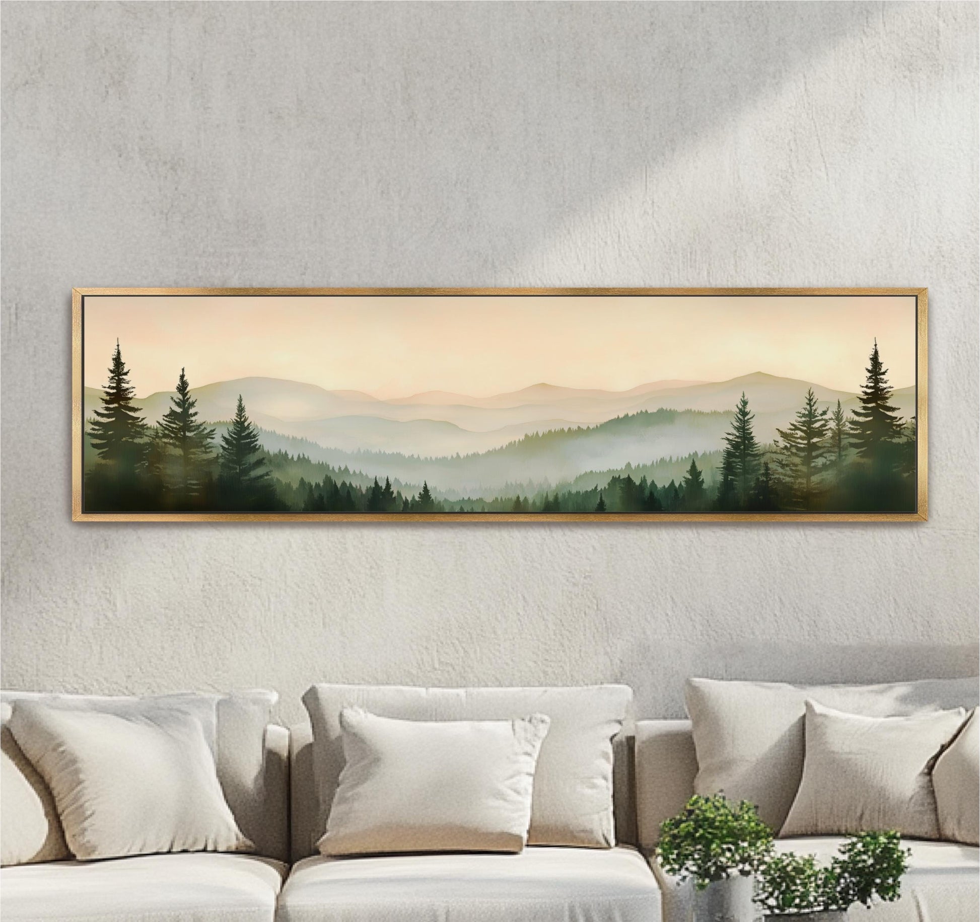 a large framed landscape painting hanging on a wall above a couch with white pillows.
