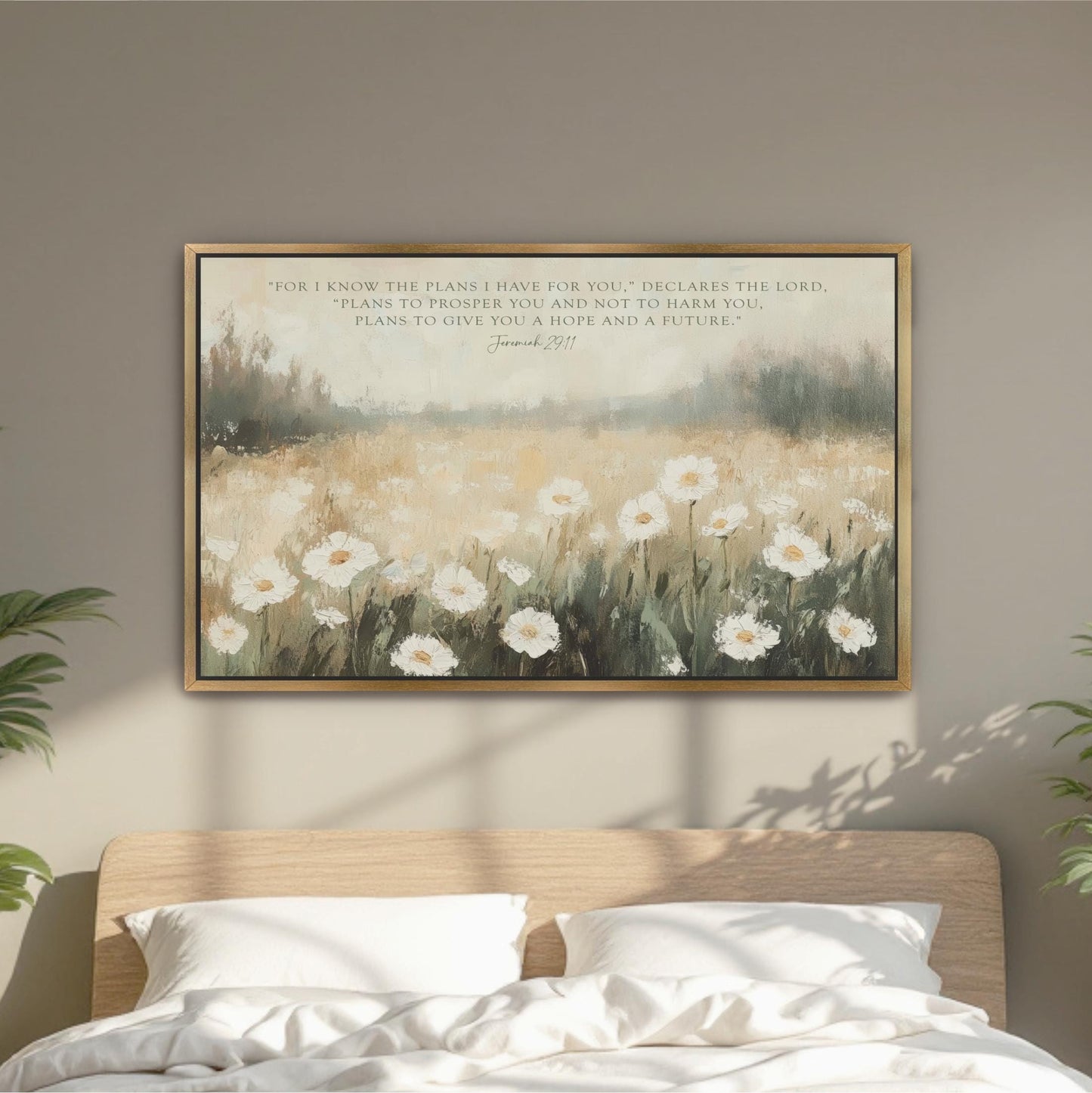 a bedroom scene with a bed and a framed painting of a field of white flowers hanging on the wall above it.