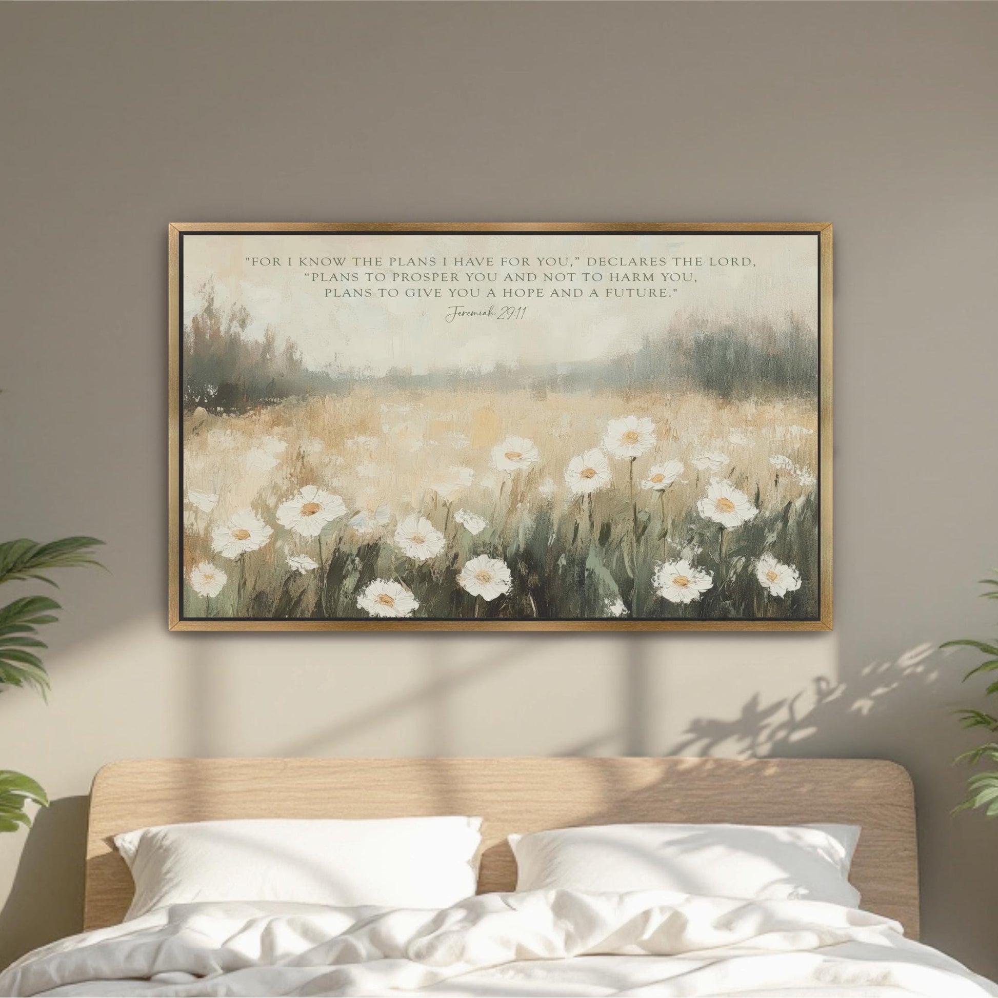 a bedroom scene with a bed and a framed painting of a field of white flowers hanging on the wall above it.