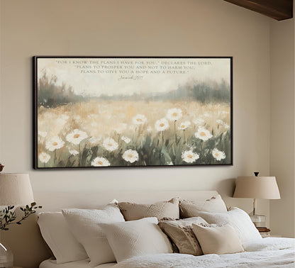 a bedroom with a large painting of a field of white flowers hanging on the wall above a bed with white pillows and a beige headboard.