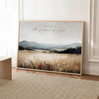 The image is a framed painting depicting a serene landscape with a field of flowers and mountains in the background.