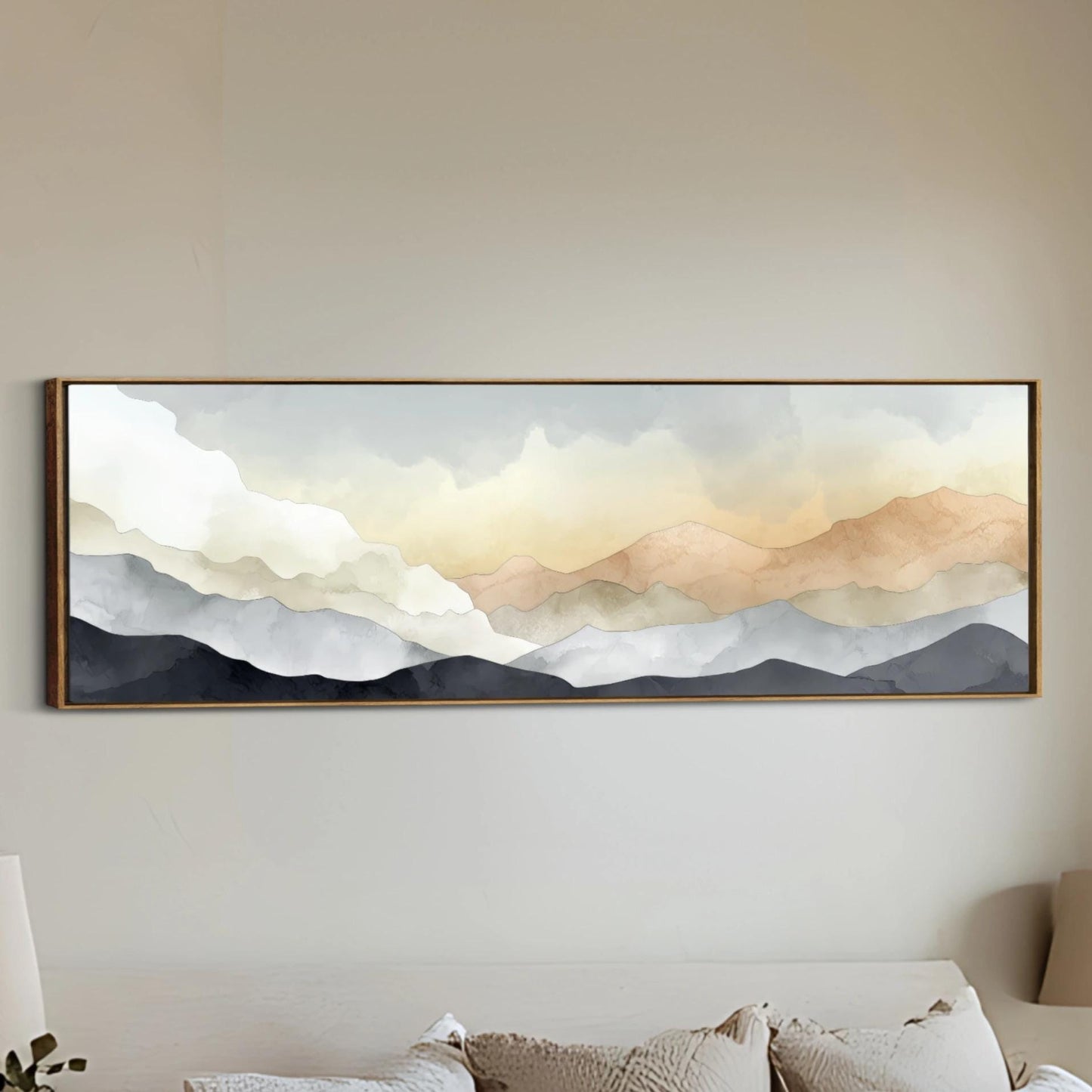 a large, framed painting of a mountain landscape hanging on a wall.