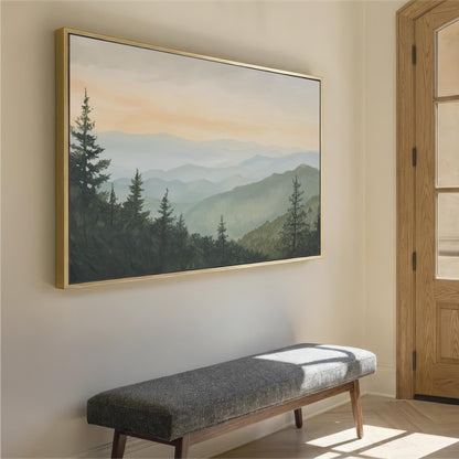 a large landscape painting hanging on a wall, depicting a serene mountain scene with pine trees and a hazy, golden sky. In the foreground, there is a gray bench positioned against the wall, providing a seating area for viewers to appreciate the artwork.
