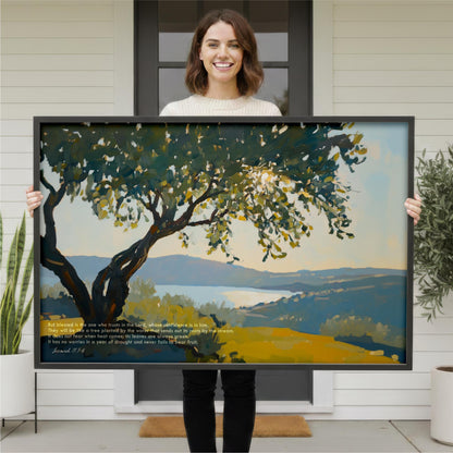 A woman stands in front of a large painting, holding it up to display the artwork.