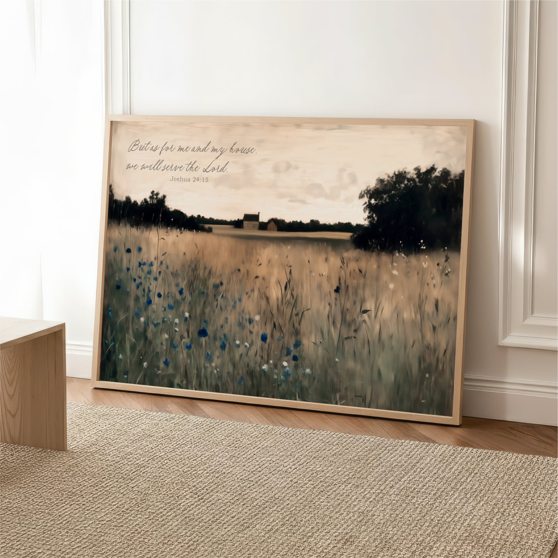 A framed painting depicting a serene landscape with a field of tall grass and trees in the background, accompanied by a Bible verse from the book of James.