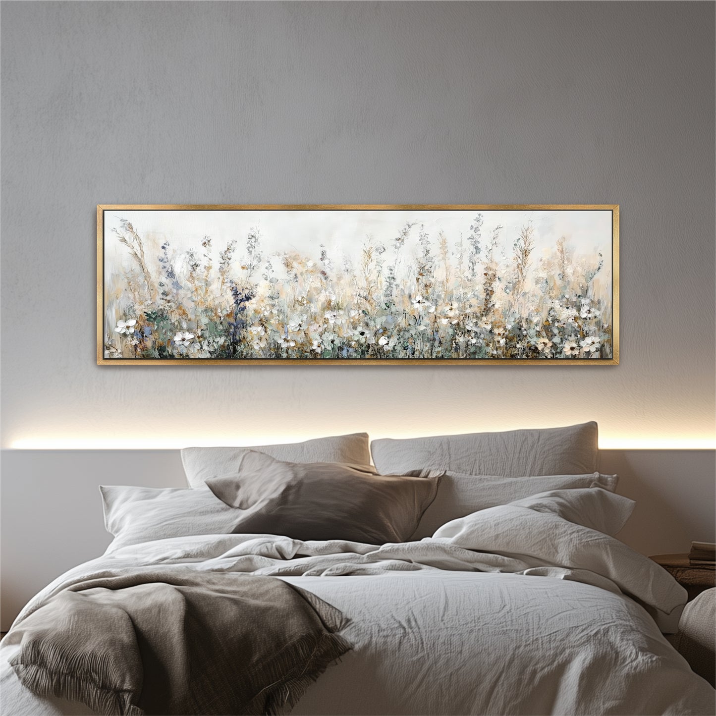 a large, framed painting of a field of flowers hanging above a bed with white bedding.