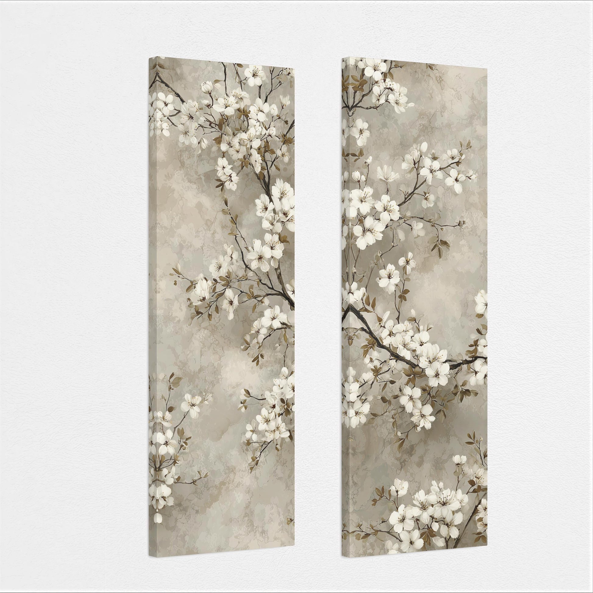 two identical paintings of white flowers on branches, displayed side by side on a wall.