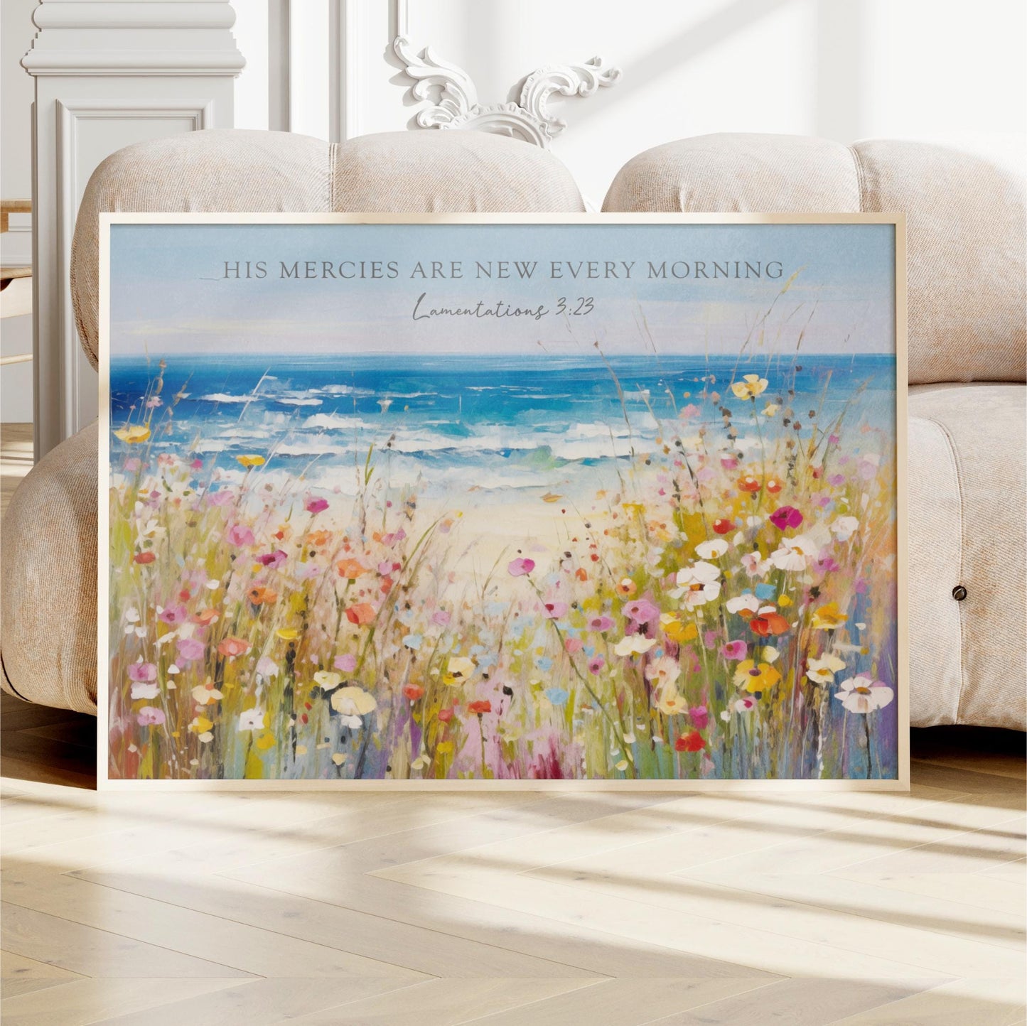 The image is a framed painting depicting a vibrant field of flowers with a serene ocean view in the background.