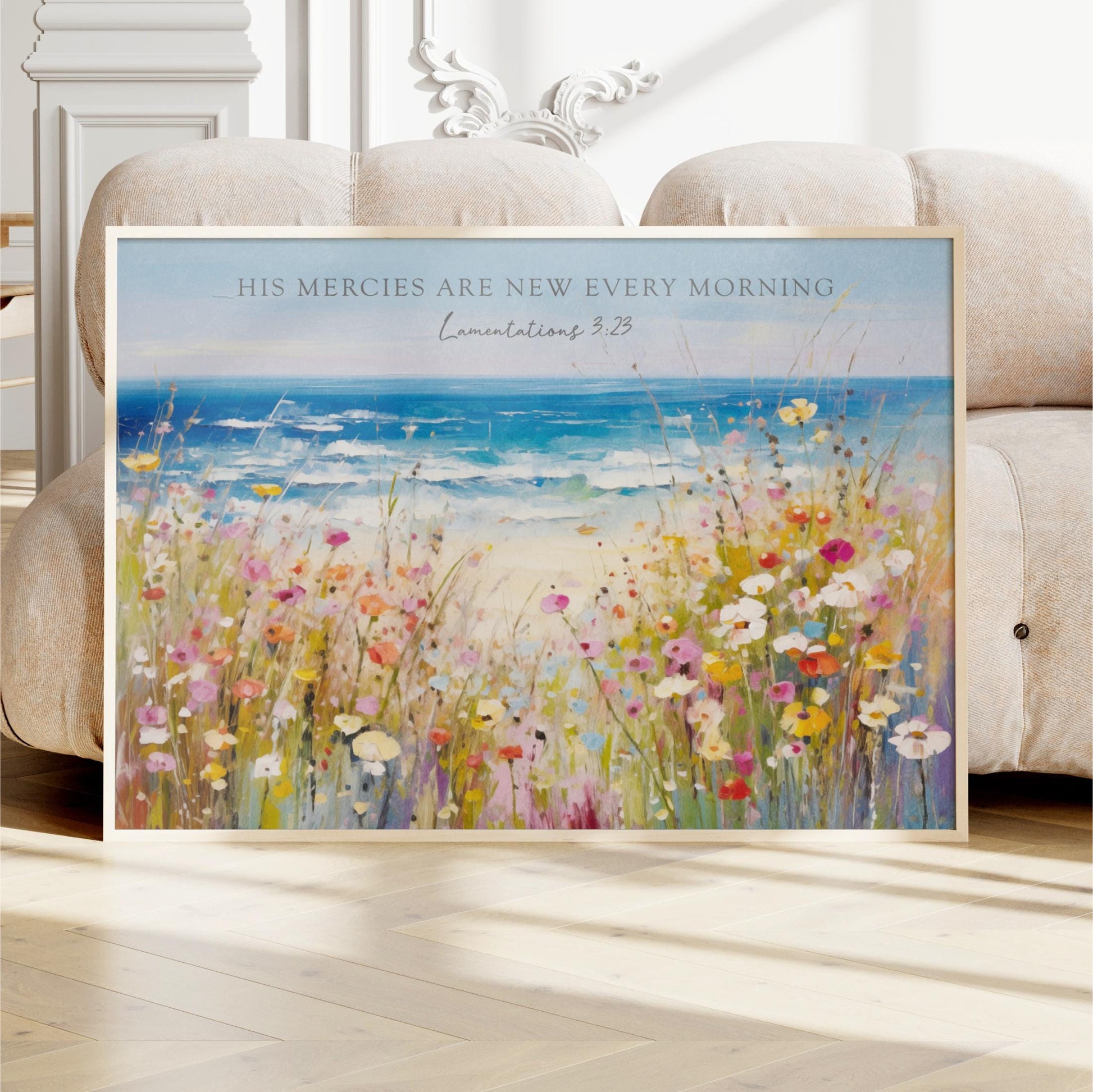 The image is a framed painting depicting a vibrant field of flowers with a serene ocean view in the background.