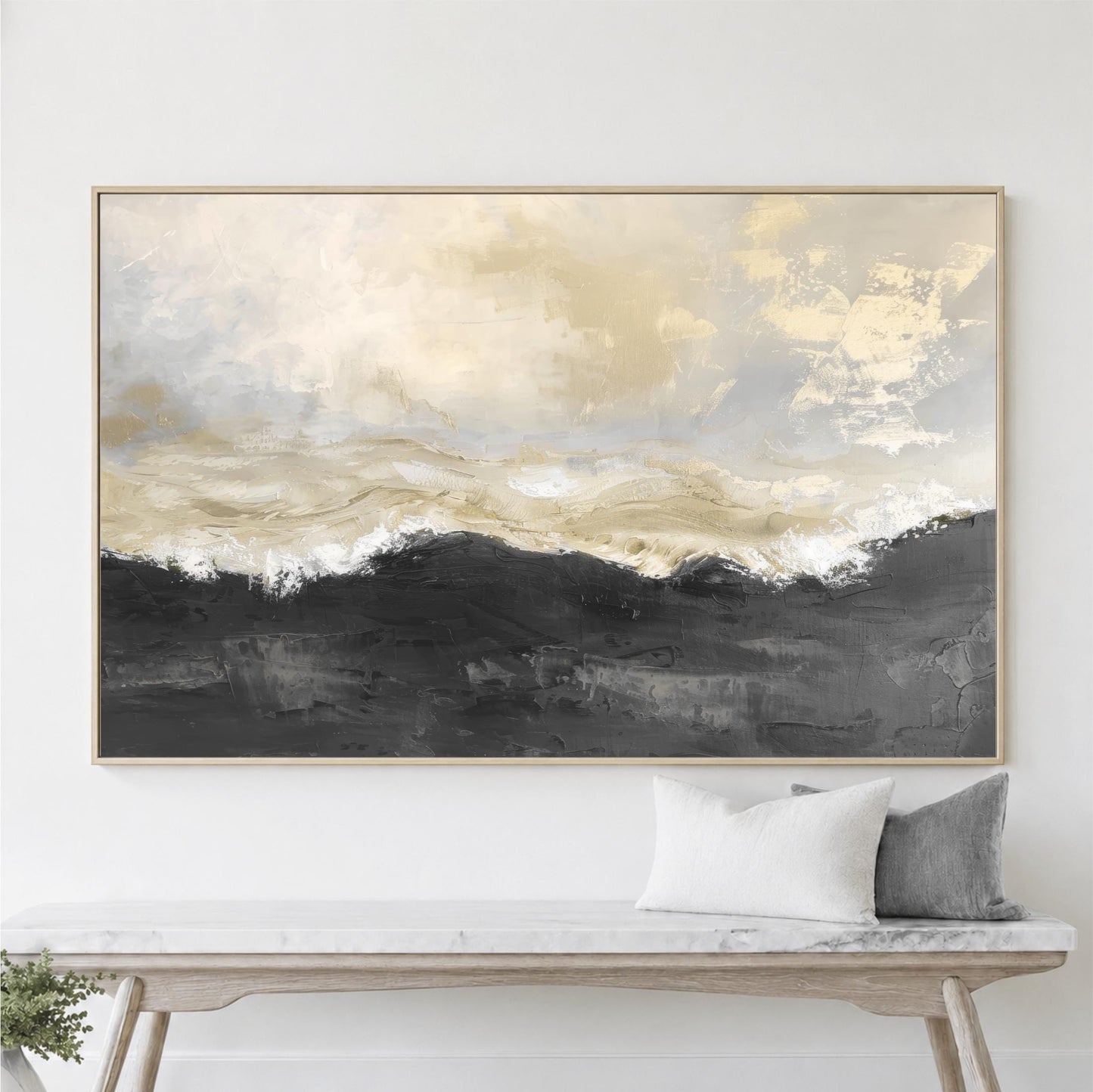 a large abstract painting hanging on a wall above a wooden bench with two pillows.