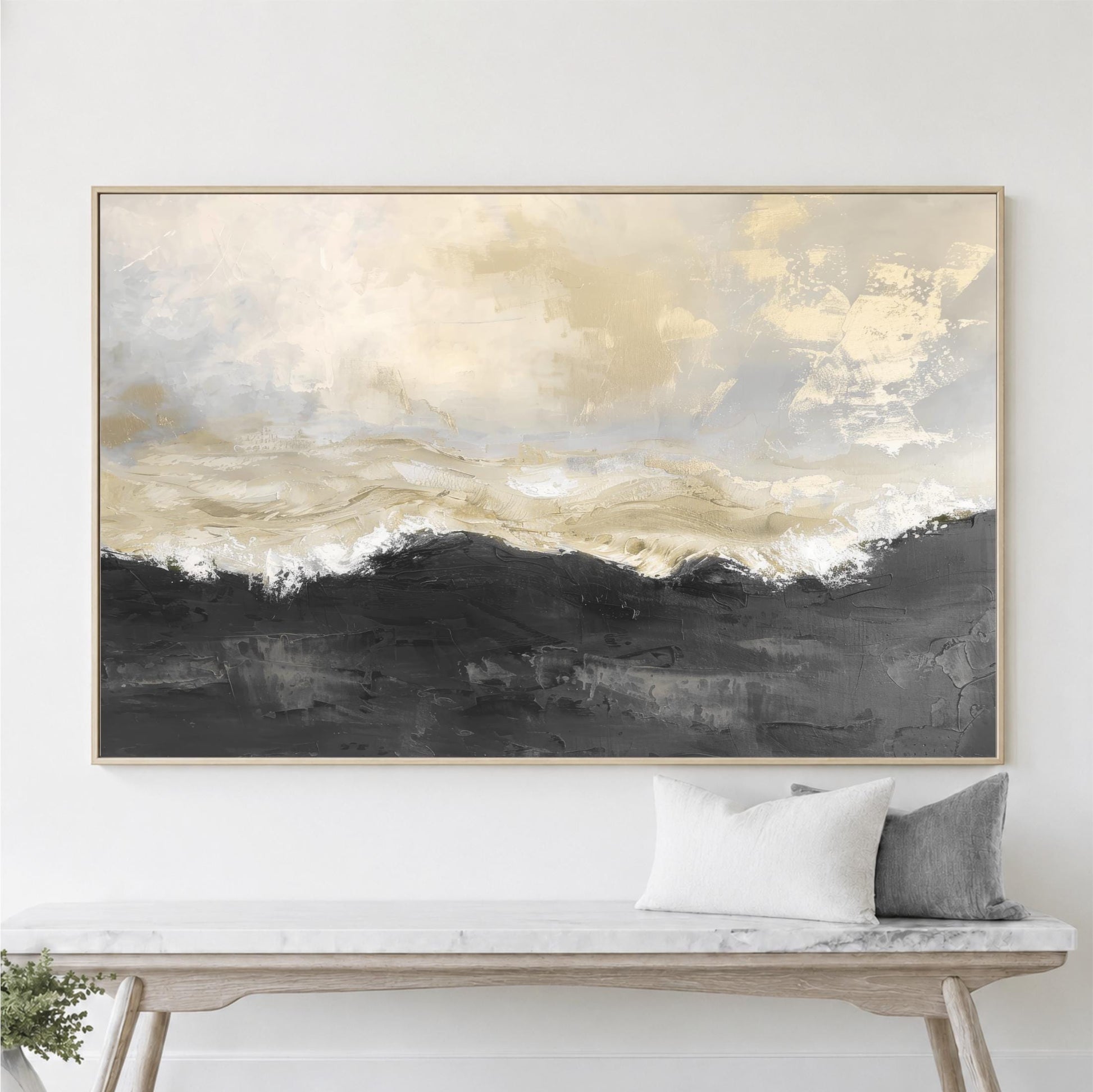 a large abstract painting hanging on a wall above a wooden bench with two pillows.