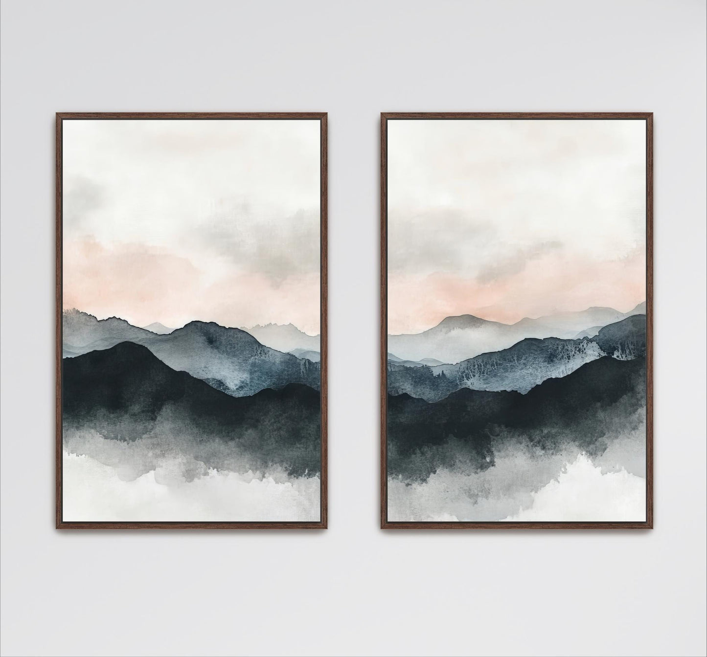 two framed watercolor paintings depicting a serene mountain landscape with a cloudy sky.