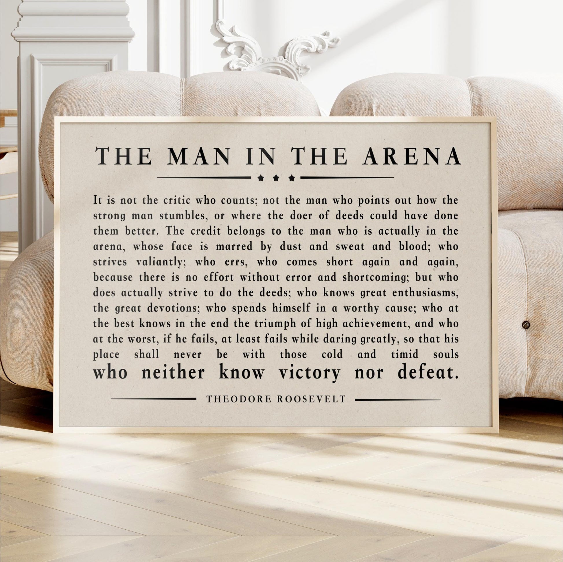a quote from Theodore Roosevelt, a famous American author and President, which is framed and displayed in a wooden frame.