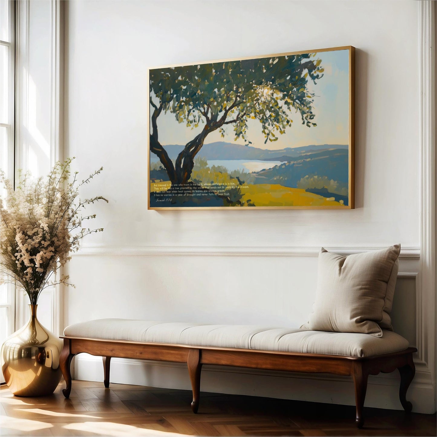 a wooden bench with a white cushion, positioned in front of a large painting depicting a serene landscape with a tree and a body of water.