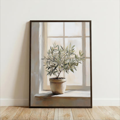A potted plant with green leaves sits on a windowsill, illuminated by natural light coming through the window.