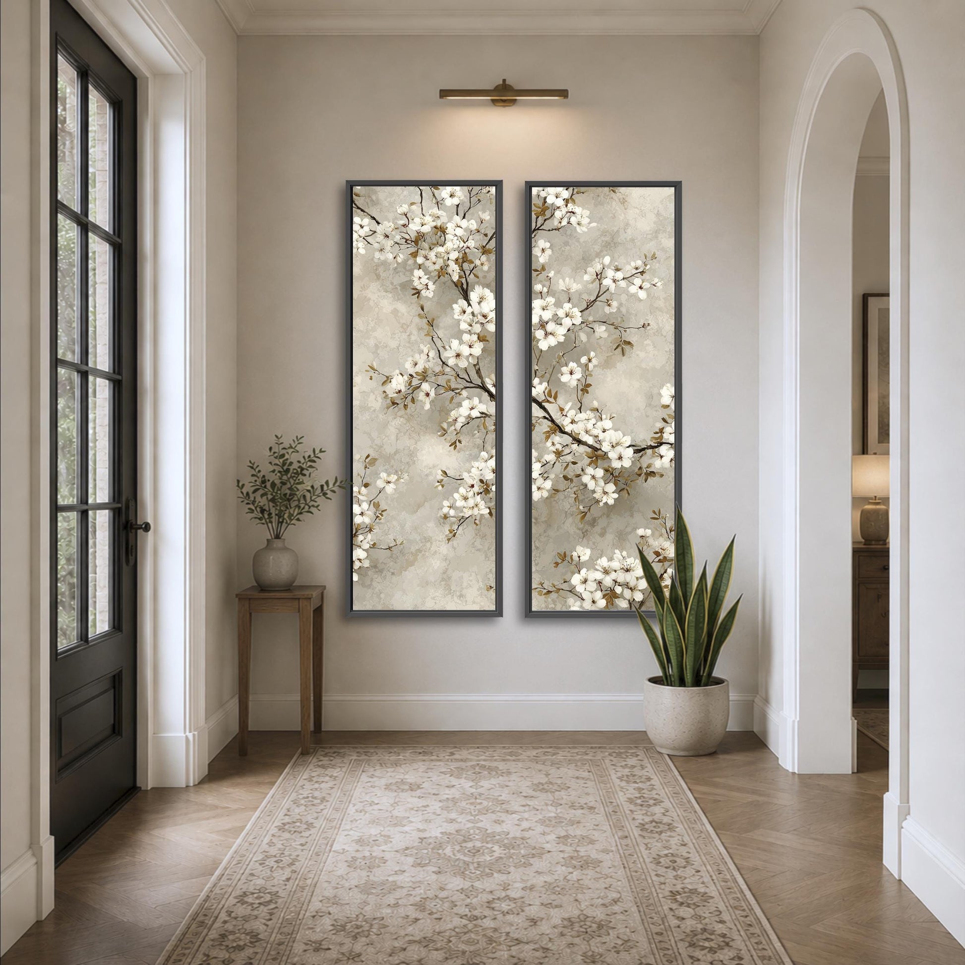 a hallway with a large floral painting hanging on the wall, a small table with a plant, and a rug on the floor.