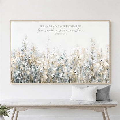 a large framed print of a field of flowers hanging on a wall above a wooden bench.