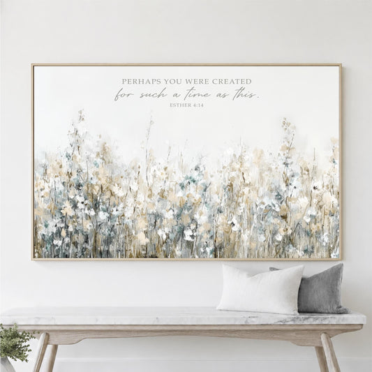a large framed print of a field of flowers hanging on a wall above a wooden bench.