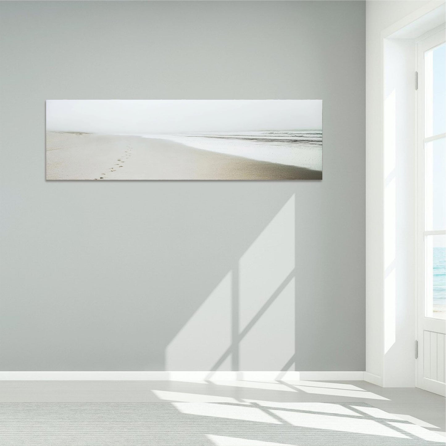 a white room with a painting on the wall