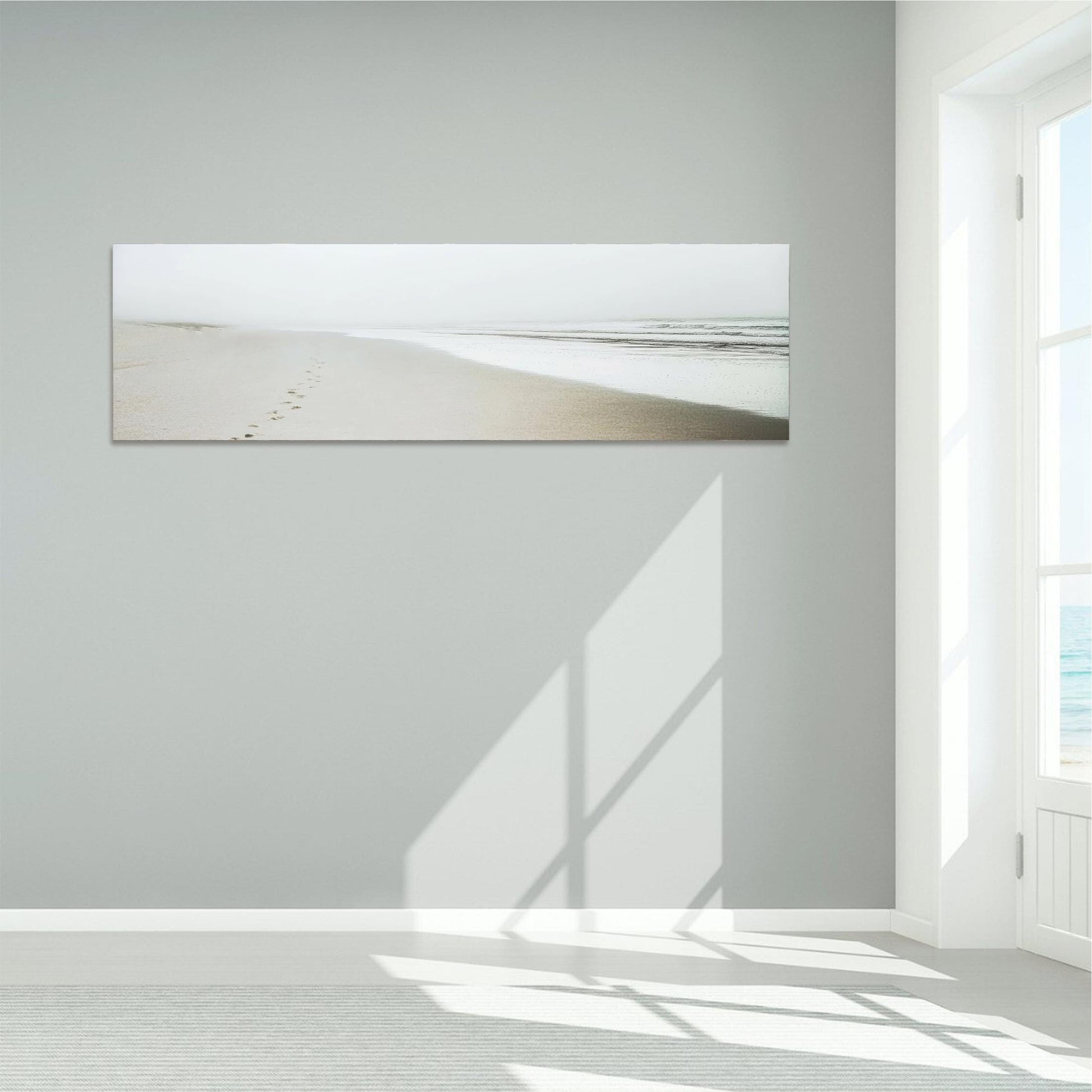 a white room with a painting on the wall