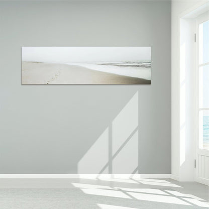a white room with a painting on the wall