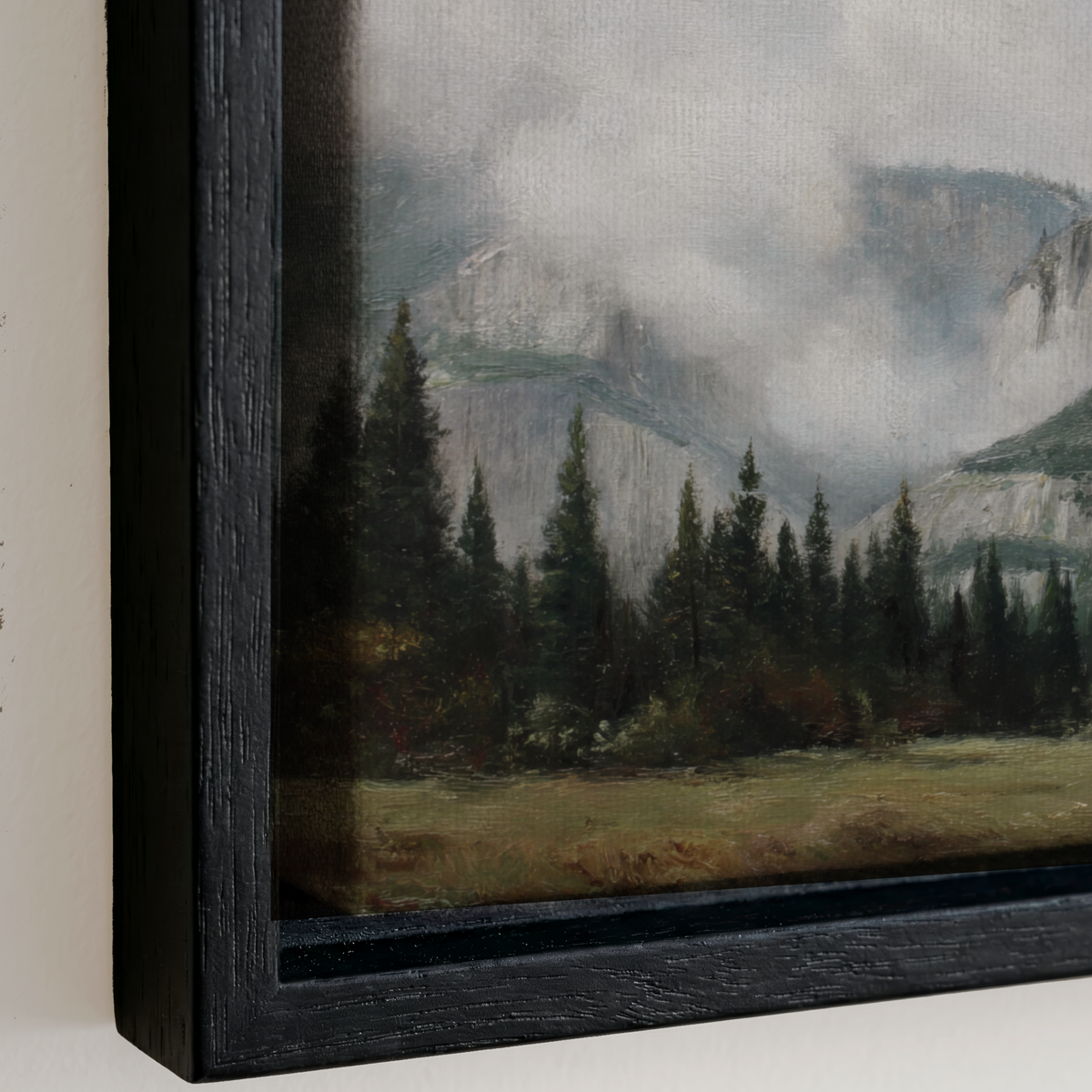 a serene landscape with a forest of pine trees and a mountain range in the background, all under a cloudy sky.