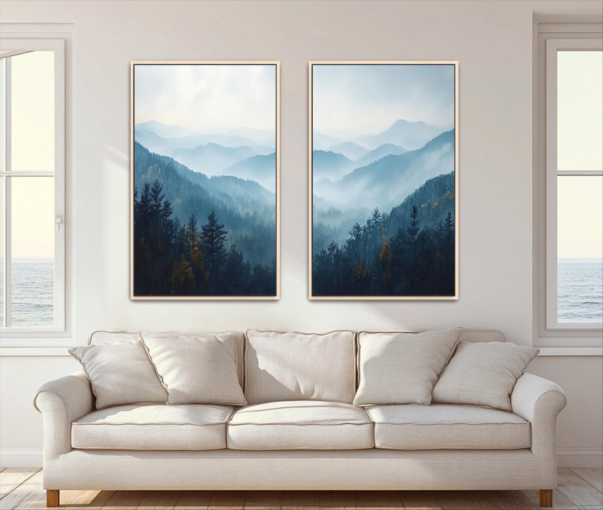 two large framed landscape paintings hanging on a wall above a white sofa in a living room.