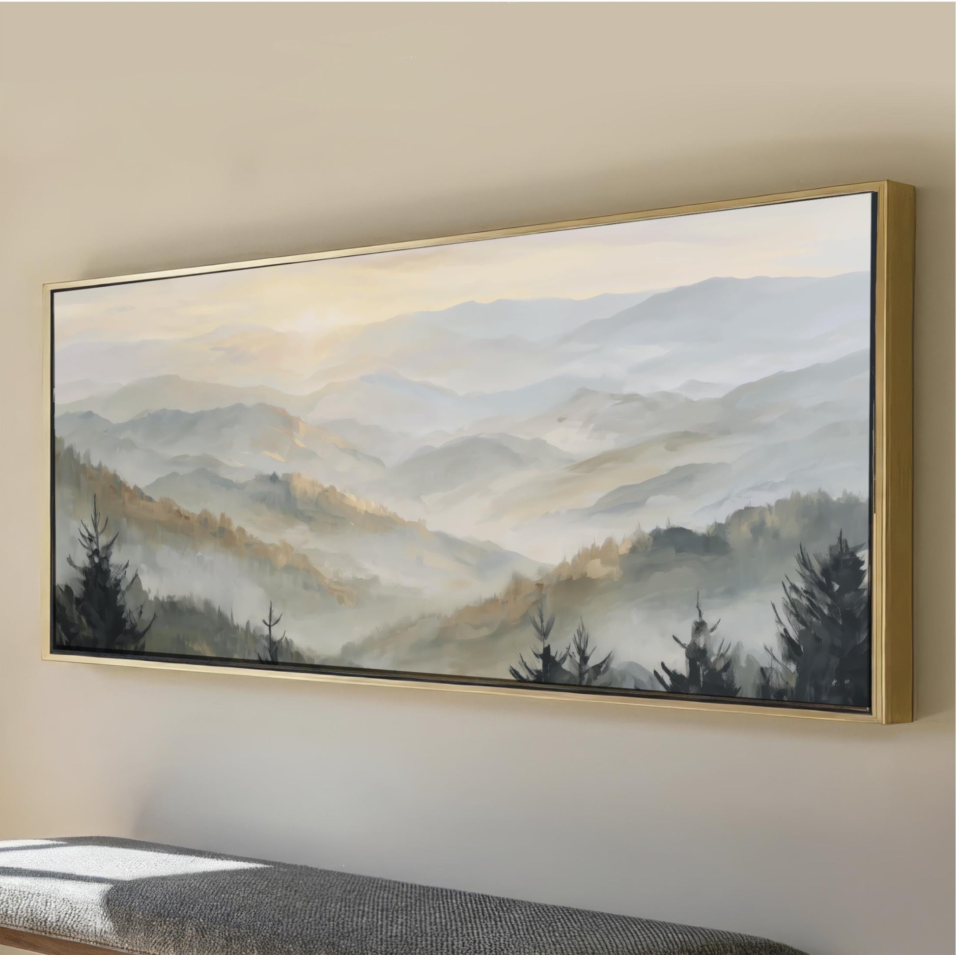 a large landscape painting hanging on a wall, depicting a serene mountain scene with trees and fog.