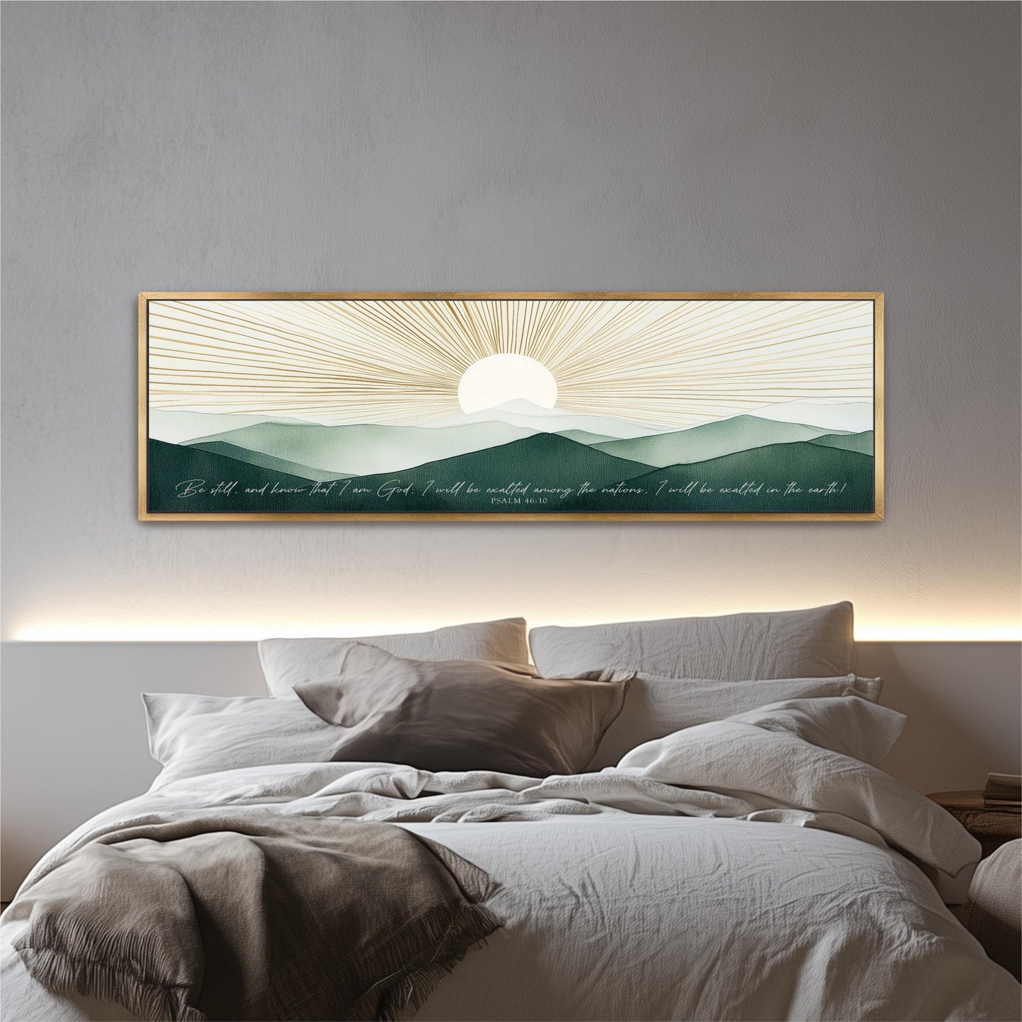 a large framed artwork depicting a serene landscape with mountains, a sun, and a quote by a person.