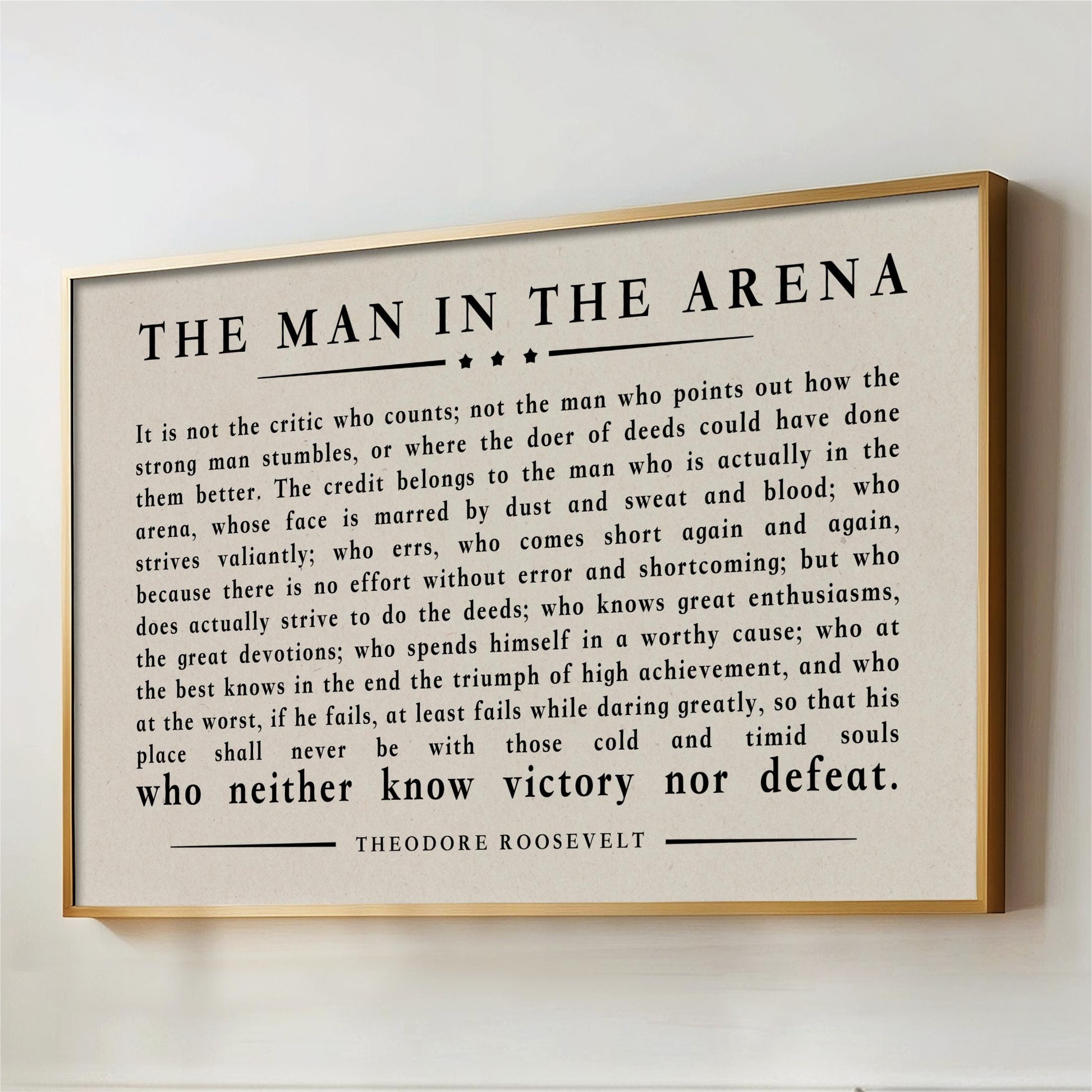 a quote from Theodore Roosevelt, a famous American president, which is framed and displayed on a wall.