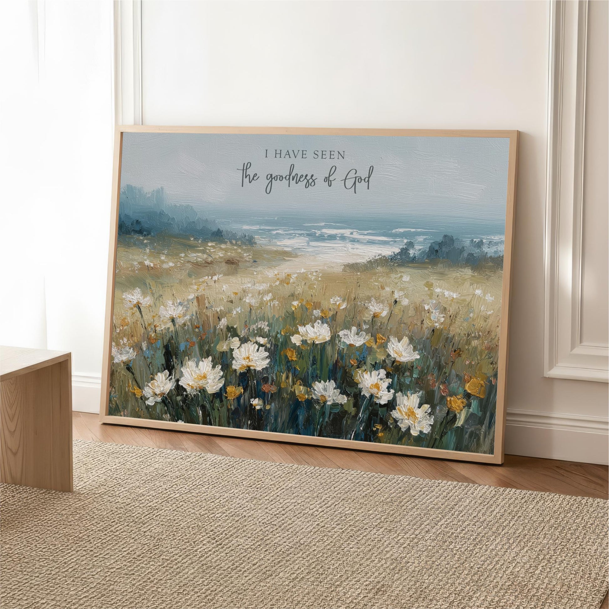 The image is a framed painting depicting a field of white flowers against a blue sky.