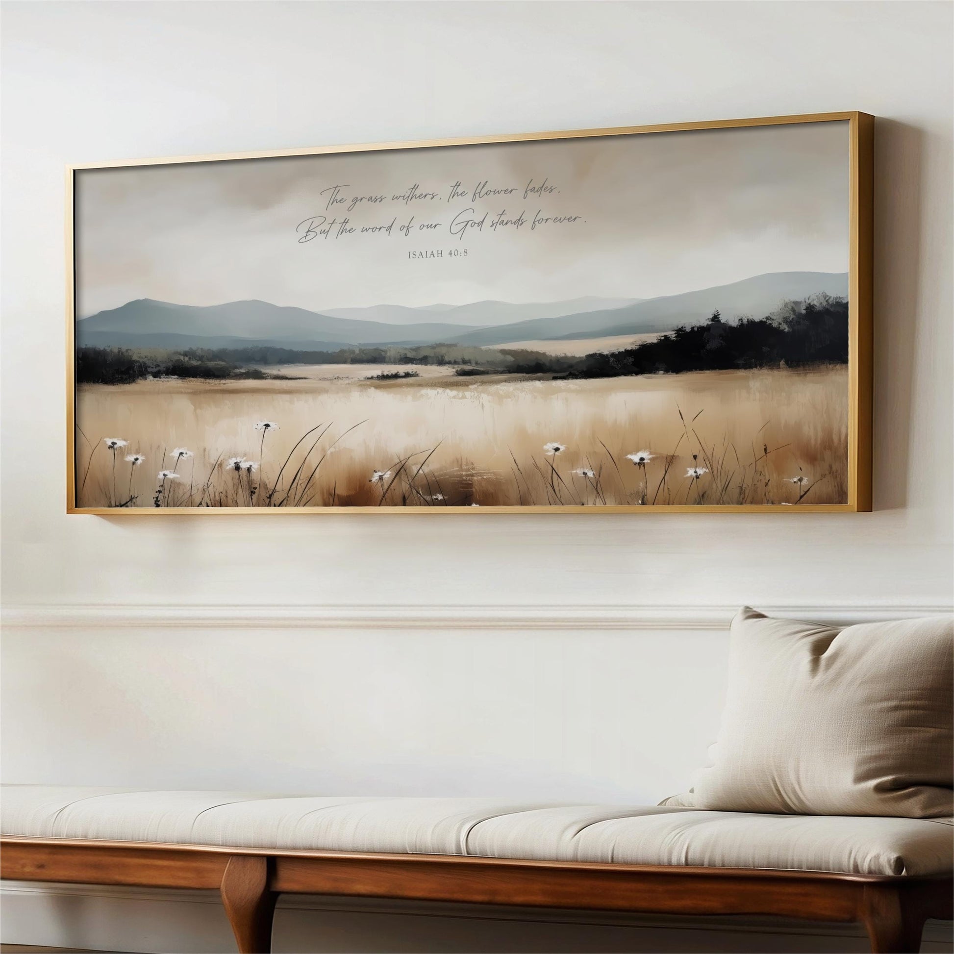 a large framed painting of a serene landscape with a field of flowers and mountains in the background.