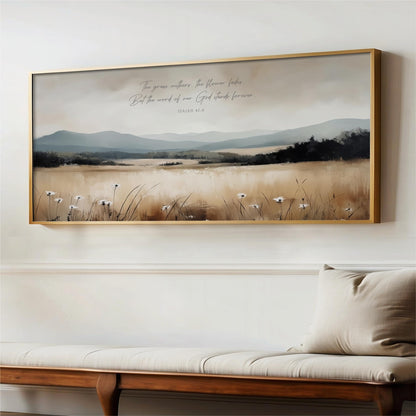 a large framed painting of a serene landscape with a field of flowers and mountains in the background.