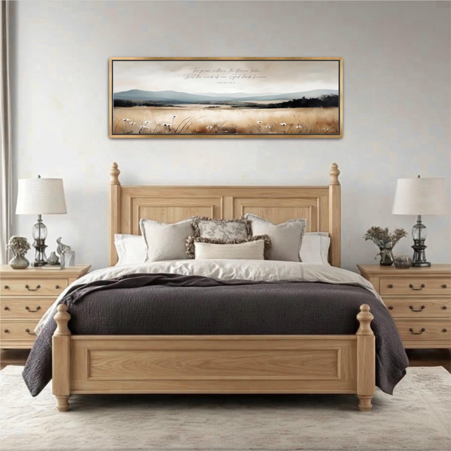 a large wooden bed with a gray comforter and pillows, flanked by two nightstands with lamps. Above the bed is a framed landscape painting depicting a serene countryside scene.