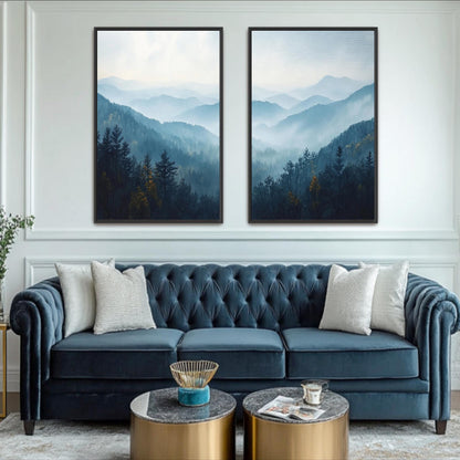 a living room with a blue velvet sofa, two framed landscape paintings on the wall, and a coffee table in front of the sofa.