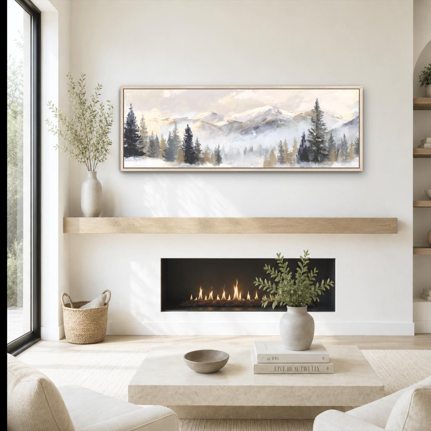 a cozy living room with a fireplace, a coffee table, and a painting of a mountain landscape hanging on the wall above the fireplace.