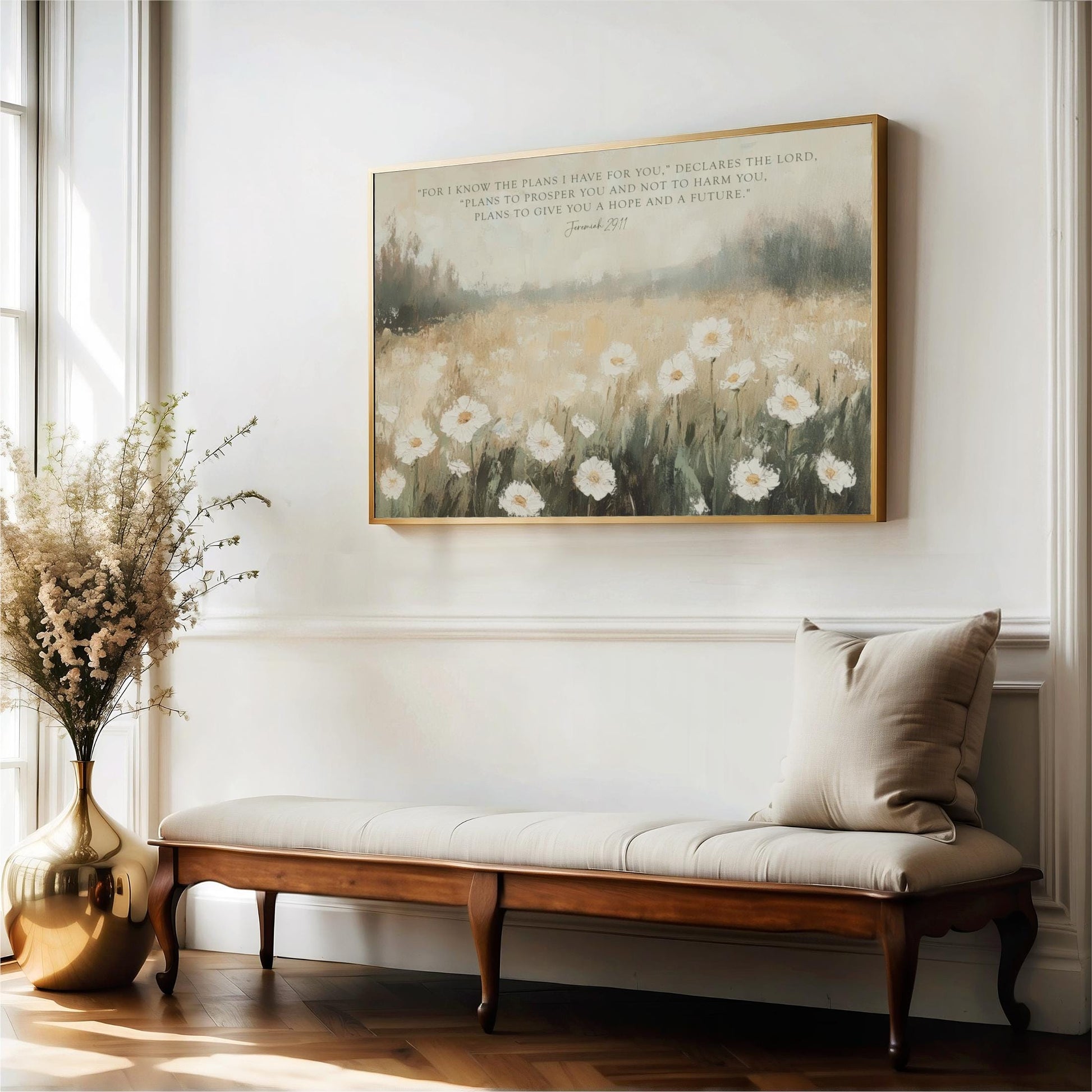 a serene indoor setting with a wooden bench, a vase of flowers, and a framed painting of a field of white flowers hanging on the wall.