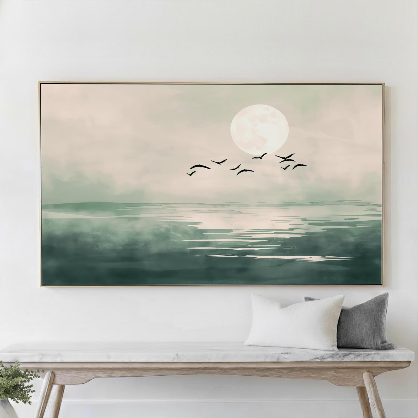 A large framed painting depicting a serene landscape with a full moon, birds flying over a body of water, and a wooden bench in the foreground.