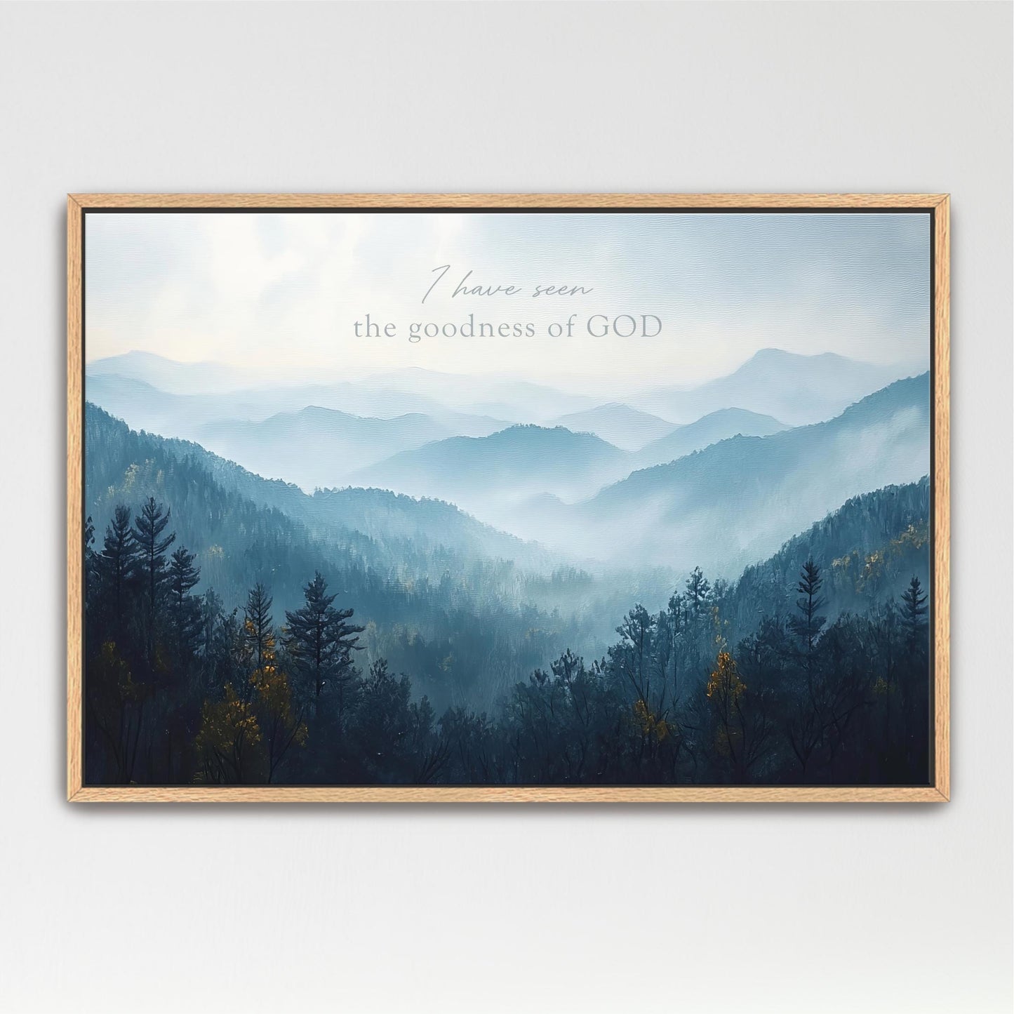 a serene mountain landscape with a forested area in the foreground.
