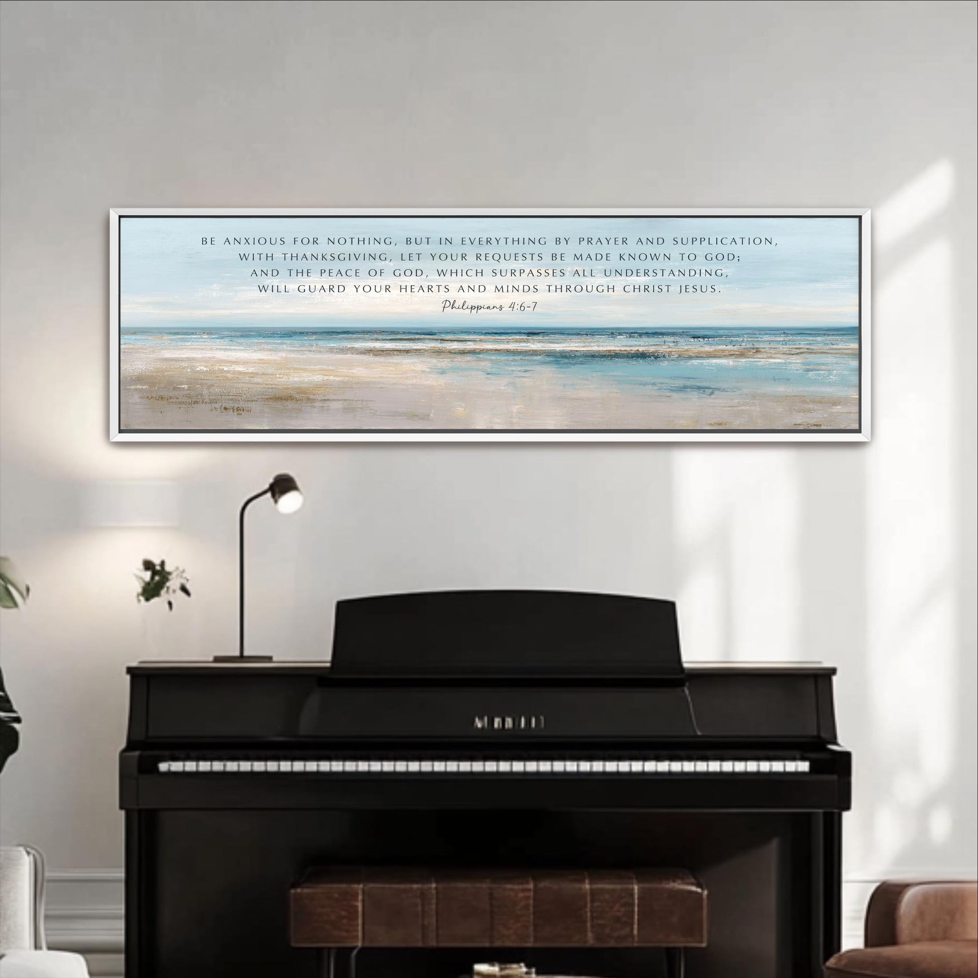 a large framed Bible verse on a white wall above a black piano keyboard.