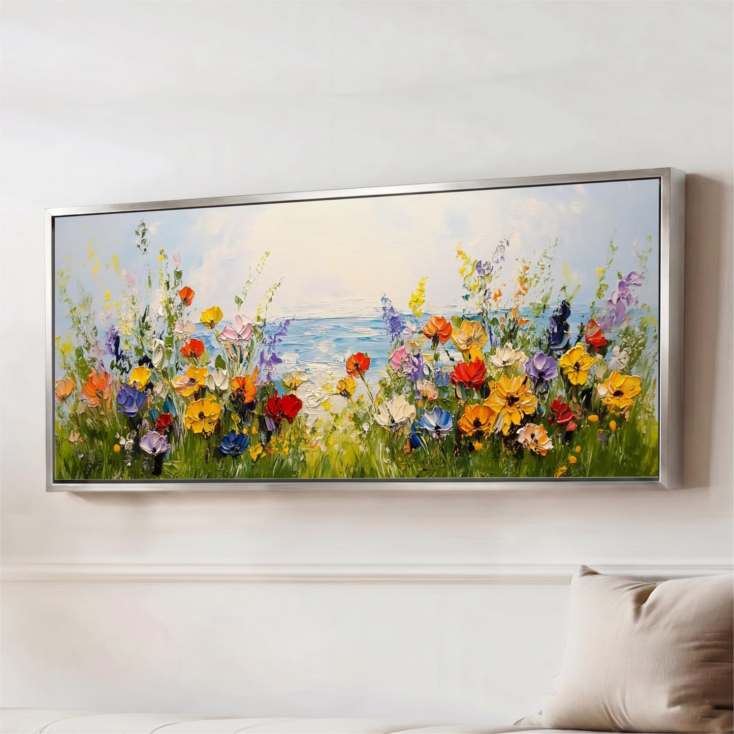 a large, colorful painting of a field of flowers with a body of water in the background.