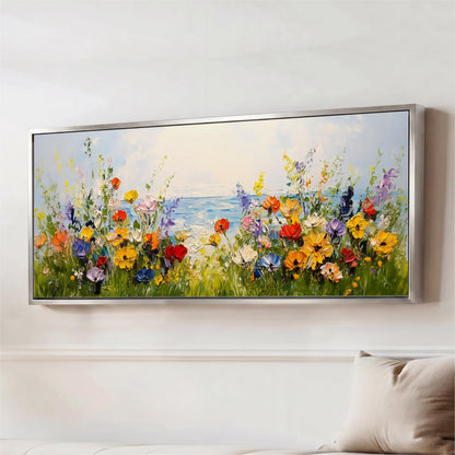 a large, colorful painting of a field of flowers with a body of water in the background.