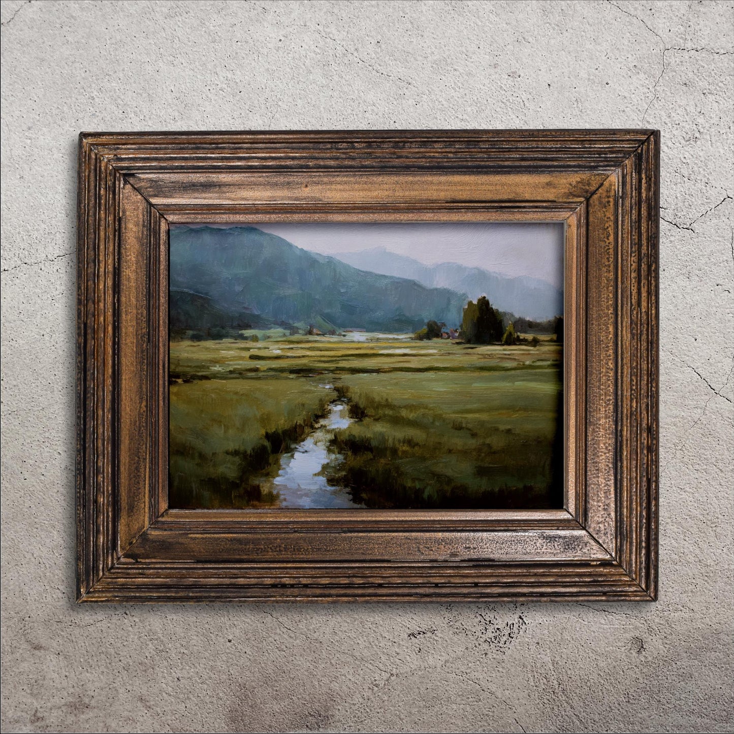 The image is a framed painting depicting a serene landscape with a winding stream, lush green fields, and distant mountains.