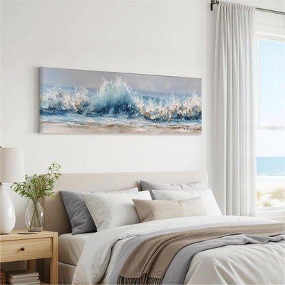 a serene bedroom scene with a large painting of a crashing wave hanging on the wall above a bed with white bedding and a gray throw blanket.