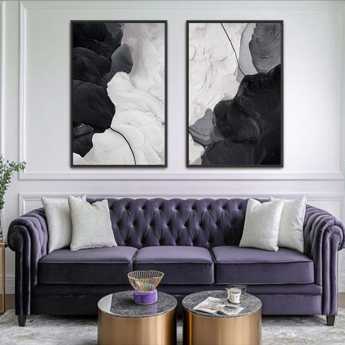 a living room with a purple velvet sofa and two framed abstract paintings hanging on the wall above it. The paintings have a monochromatic color scheme, with one depicting a black and white abstract design and the other showing a black and white abstract pattern. The room also includes a coffee table with a magazine and a small bowl on it.