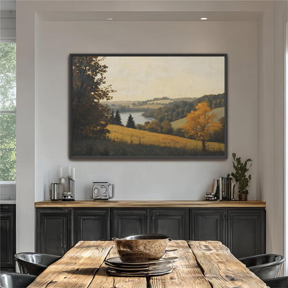a large painting of a countryside landscape hanging on a wall above a wooden dining table. The table is set with plates and bowls, and there are some plants and decorative items on the table.