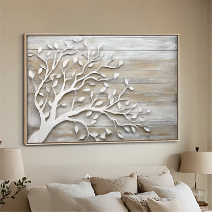 a large wooden wall art piece depicting a tree with white leaves, hanging above a bed with white pillows.